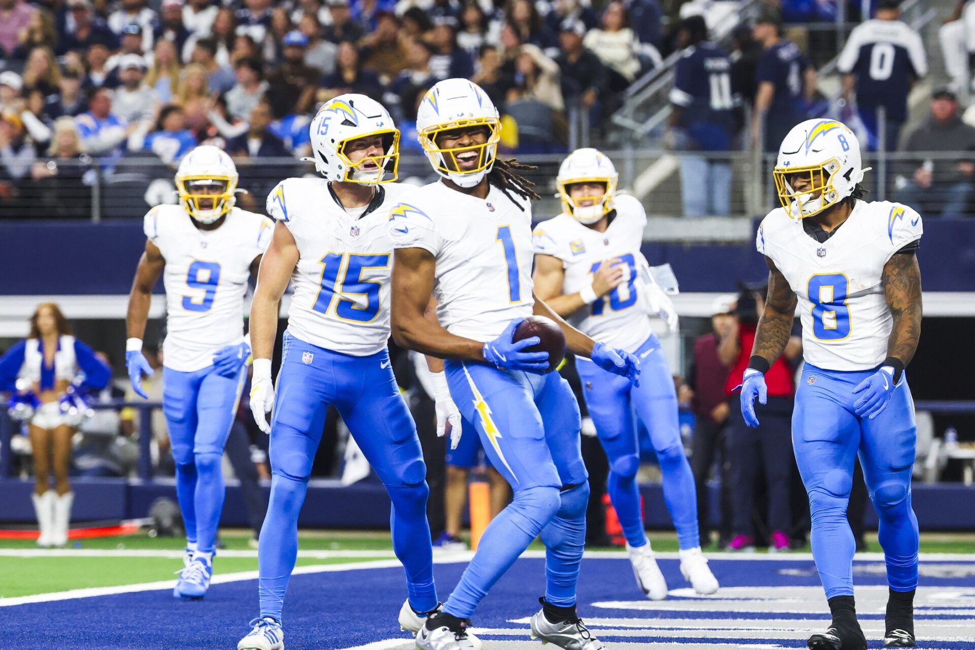 Los Angeles Chargers wide receiver Quentin Johnston (1) celebrates with wide receiver Ladd McConkey (15) and running back Omarion Hampton (8) after catching a touchdown pass against the Dallas Cowboys during the first quarter at AT&T Stadium.