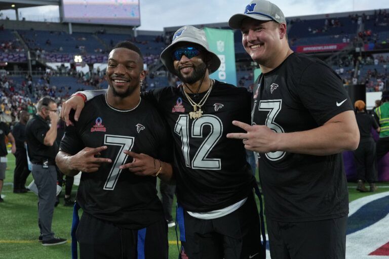 Atlanta Falcons running back Bijan Robinson (7), special teams player KhaDarel Hodge (12) and guard Chris Lindstrom (63) pose during the 2025 Pro Bowl Games at Camping World Stadium.