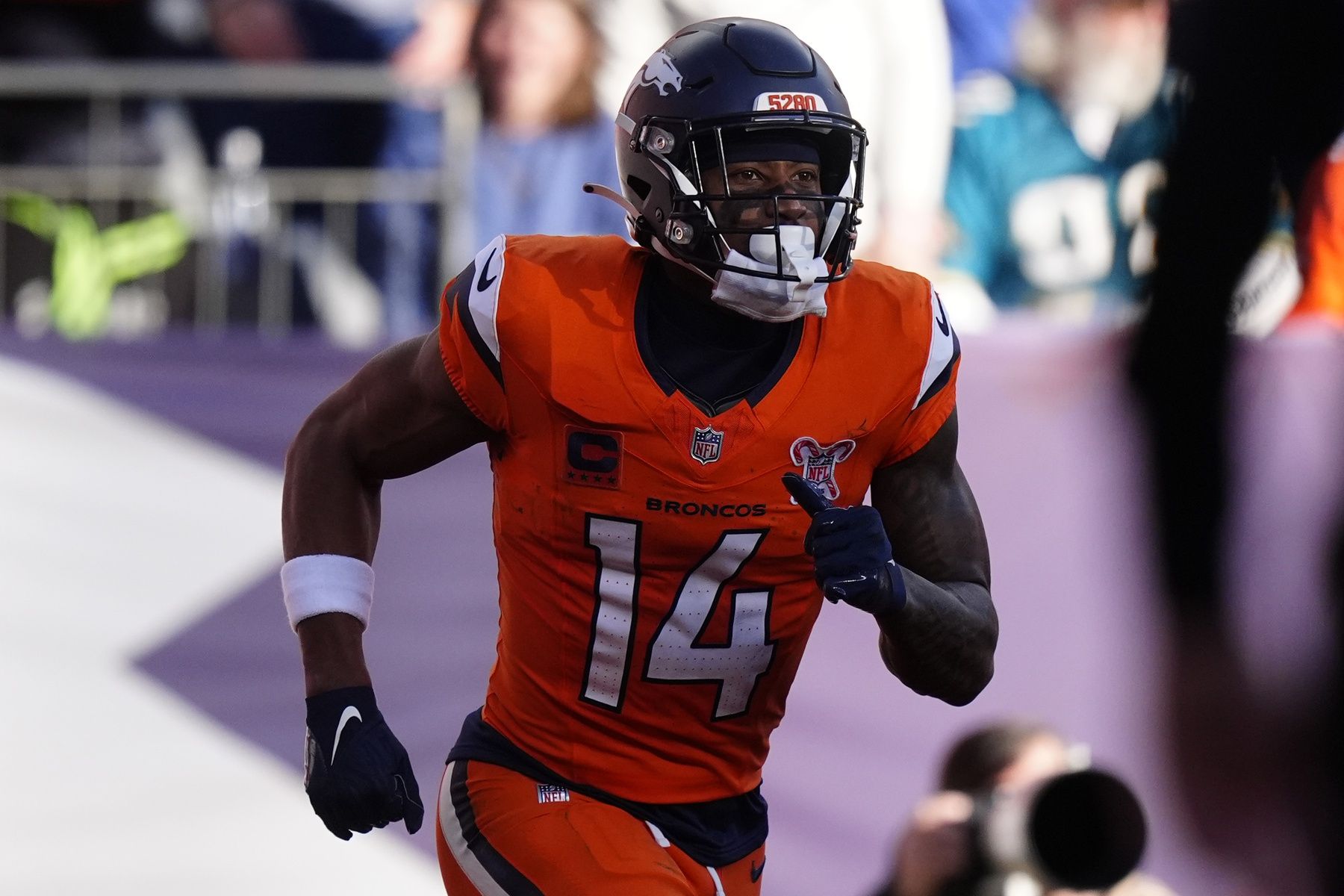 Denver Broncos wide receiver Courtland Sutton (14) reacts after scoring a touchdown against the Jacksonville Jaguars during the first half at Empower Field at Mile High.