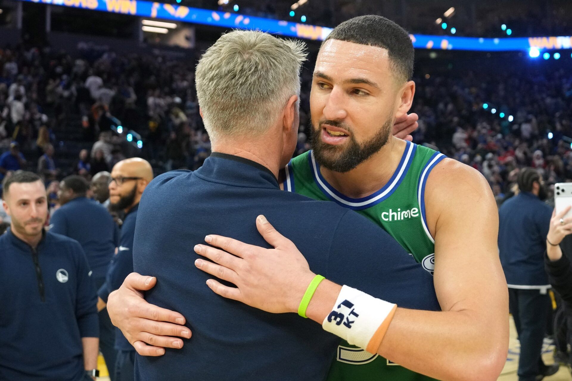 Dallas Mavericks guard Klay Thompson (right) and Golden State Warriors head coach Steve Kerr (center left) greet each other after the game at Chase Center.