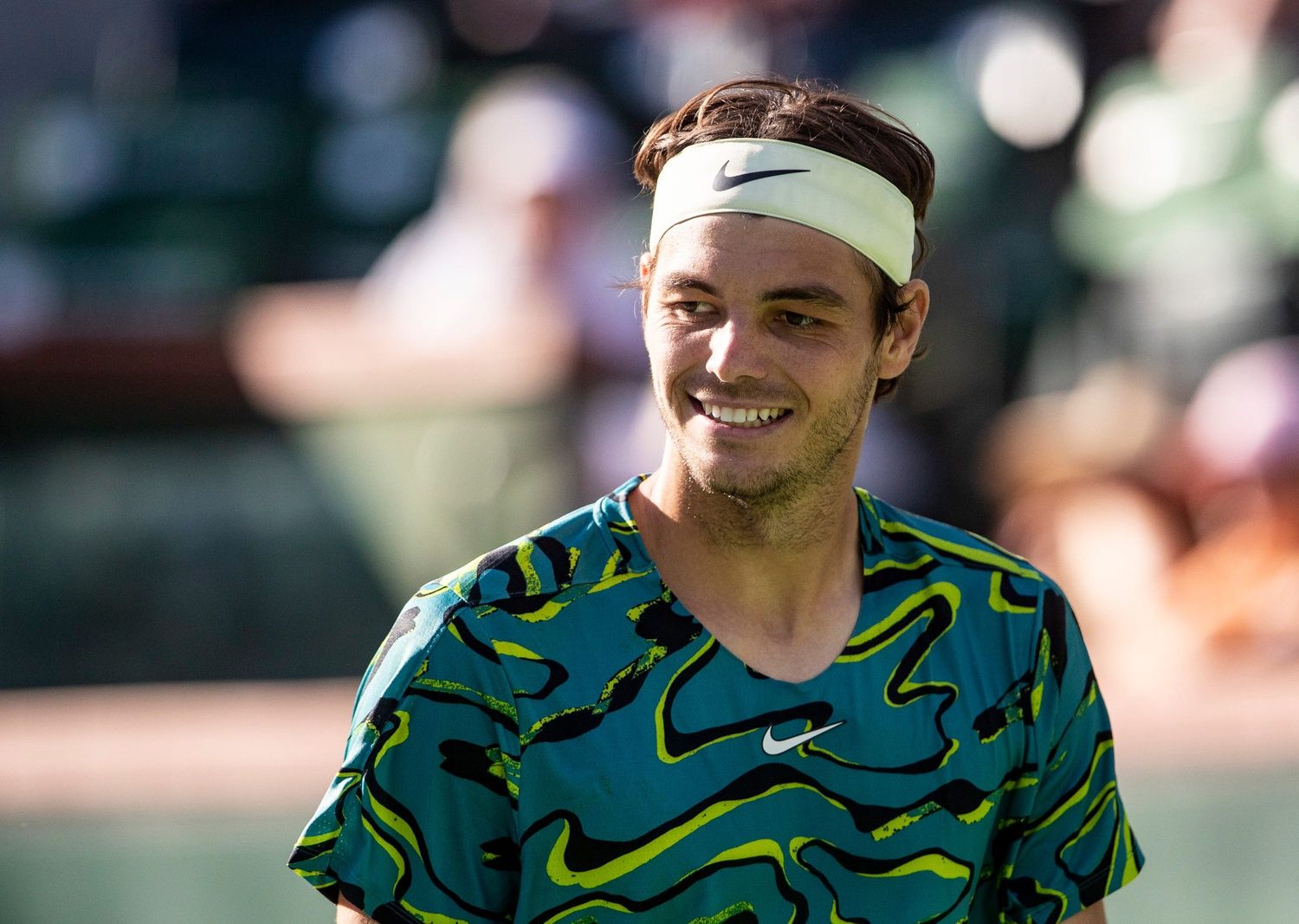 Taylor Fritz of the United States smiles after a point over Sebastian Baez of Argentina during their third-round match at the BNP Paribas Open at the Indian Wells Tennis Garden in Indian Wells, Calif., Monday, March 13, 2023.