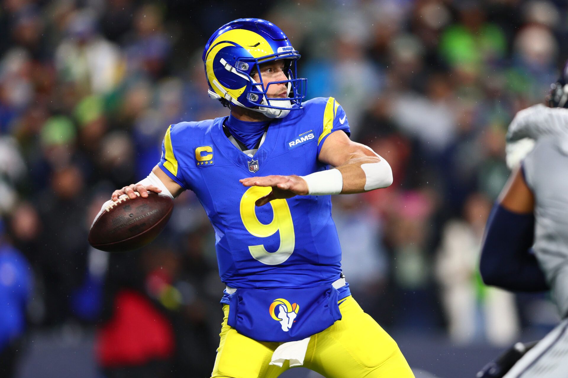 Los Angeles Rams quarterback Matthew Stafford (9) passes against the Seattle Seahawks in the first half at Lumen Field.