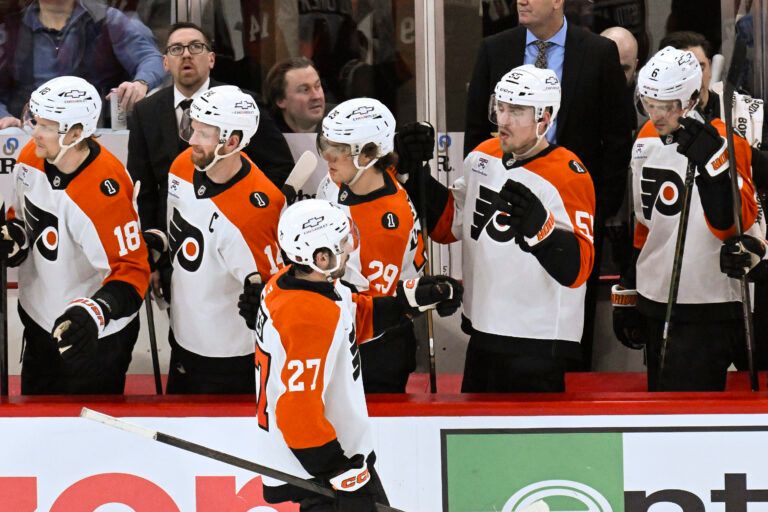 Philadelphia Flyers left wing Noah Cates (27) celebrates with teammates after scoring a goal against the Chicago Blackhawks during the second period at United Center.