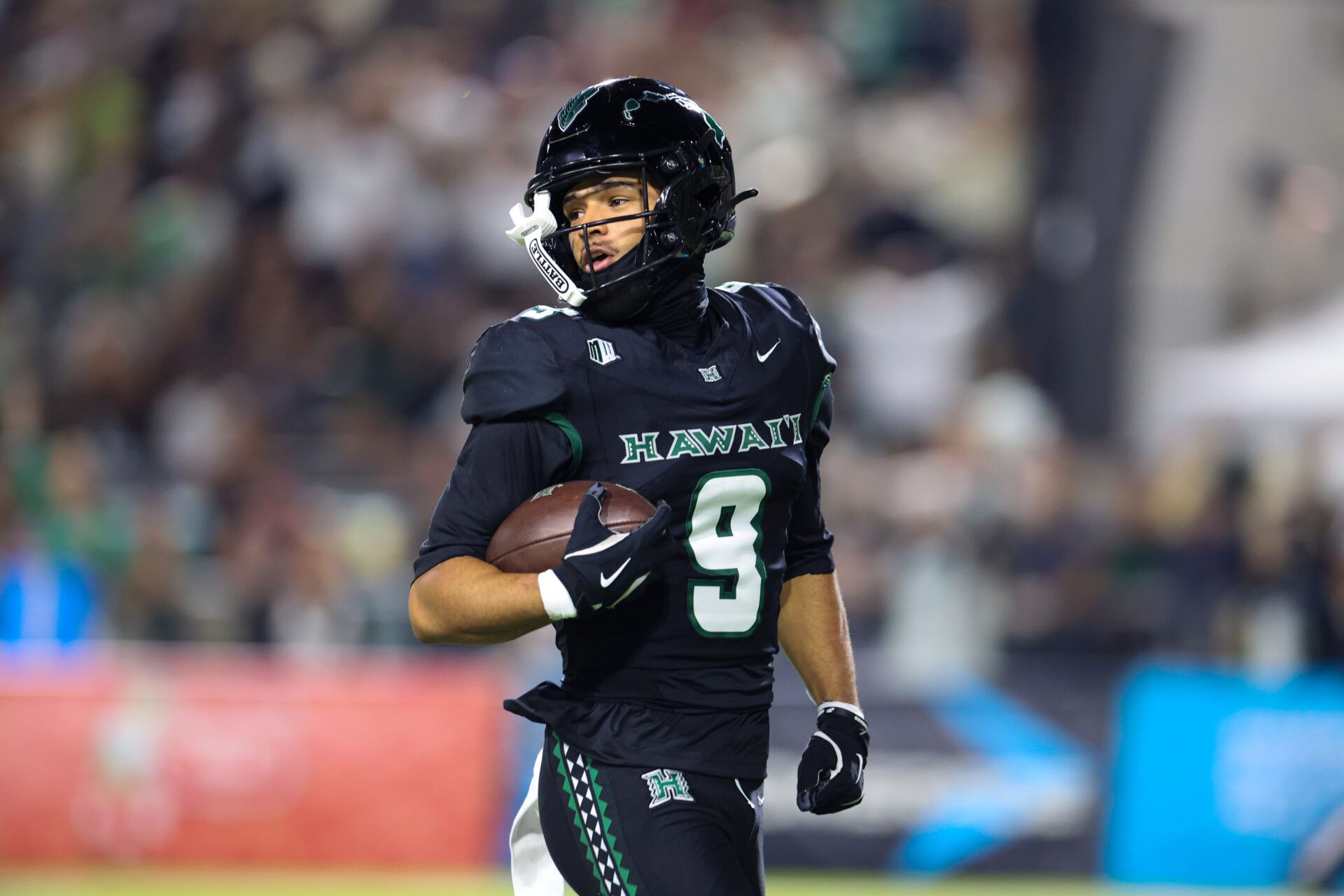 Hawaii Rainbow Warriors wide receiver Jackson Harris (9) reacts after scoring a touchdown against the Wyoming Cowboys during the second quarter at Clarence T.C. Ching Athletics Complex.