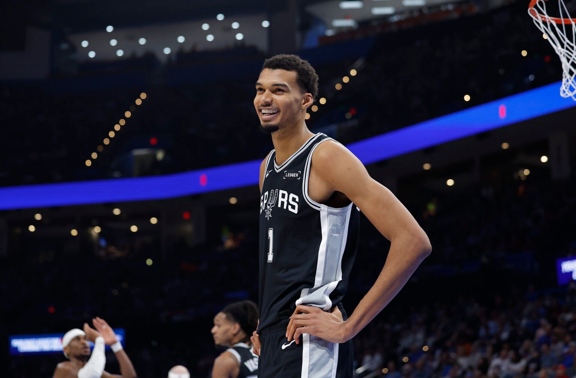 San Antonio Spurs forward Victor Wembanyama (1) smiles after a play against the Oklahoma City Thunder during the second half at Paycom Center.