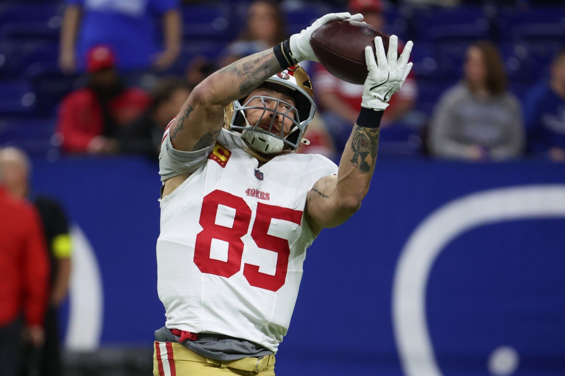 San Francisco 49ers tight end George Kittle (85) warms up before the game against the Indianapolis Colts at Lucas Oil Stadium.