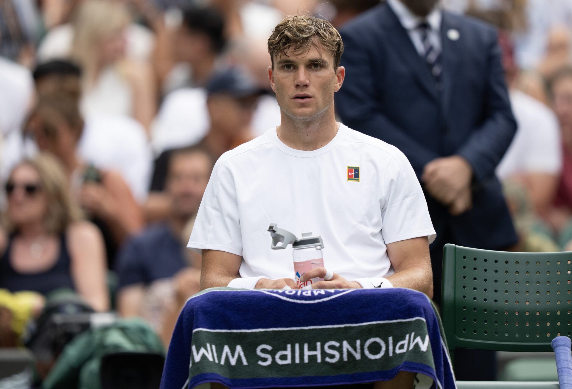 Jack Draper of Great Britain at a change of ends during his match against Marin Cilic of Croatia on day four at the All England Lawn Tennis and Croquet Club.