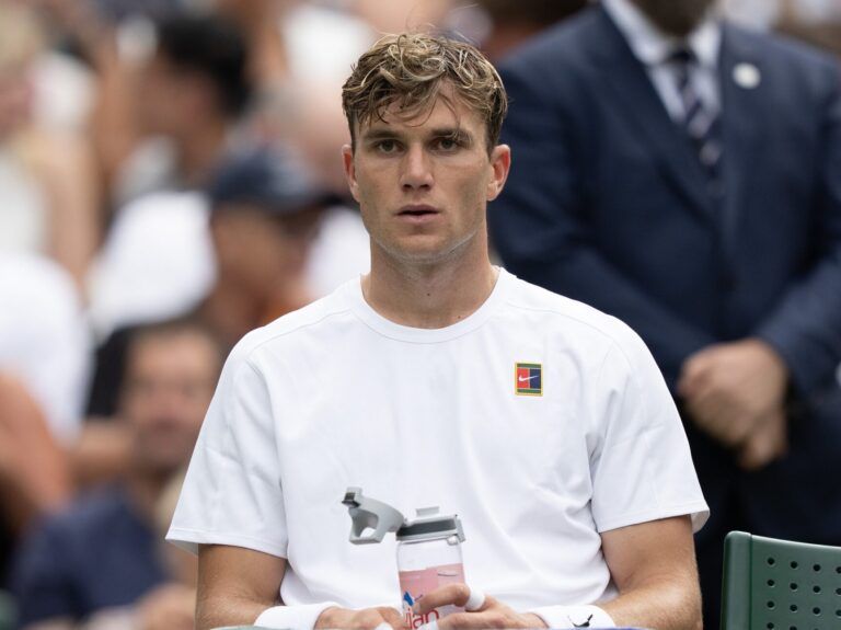 Jack Draper of Great Britain at a change of ends during his match against Marin Cilic of Croatia on day four at the All England Lawn Tennis and Croquet Club.