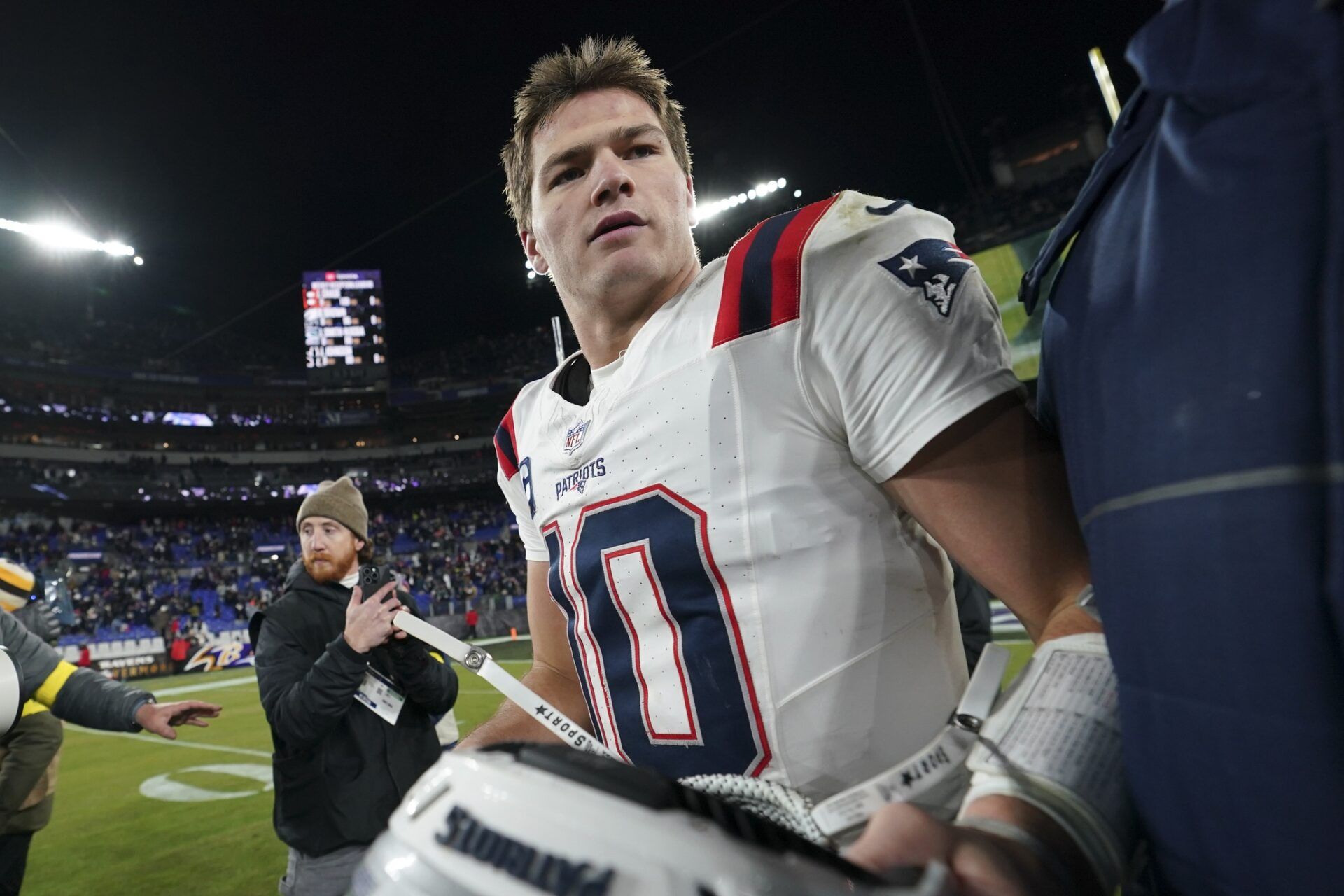 New England Patriots quarterback Drake Maye (10) walks off the field after defeating the Baltimore Ravens at M&T Bank Stadium.