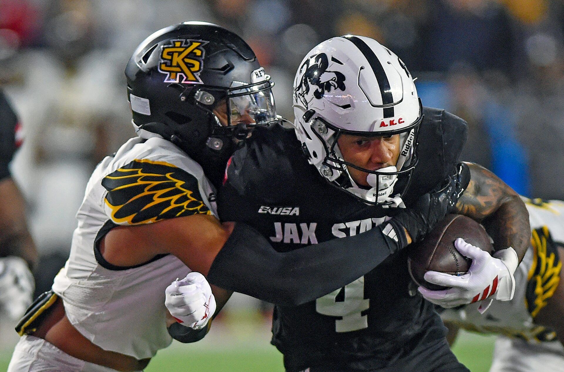 Jax State's Cam Cook tries to evade the tackle of Kennesaw State's Alexander Ford during the C-USA Championship at AmFirst Stadium in Jacksonville, Alabama December 5, 2025. (Dave Hyatt / Hyatt Media LLC)
