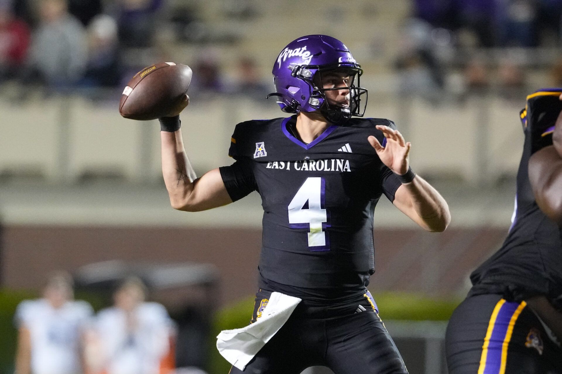 East Carolina Pirates quarterback Katin Houser (4) throws the ball against the Tulsa Golden Hurricane during the second half at Dowdy-Ficklen Stadium.