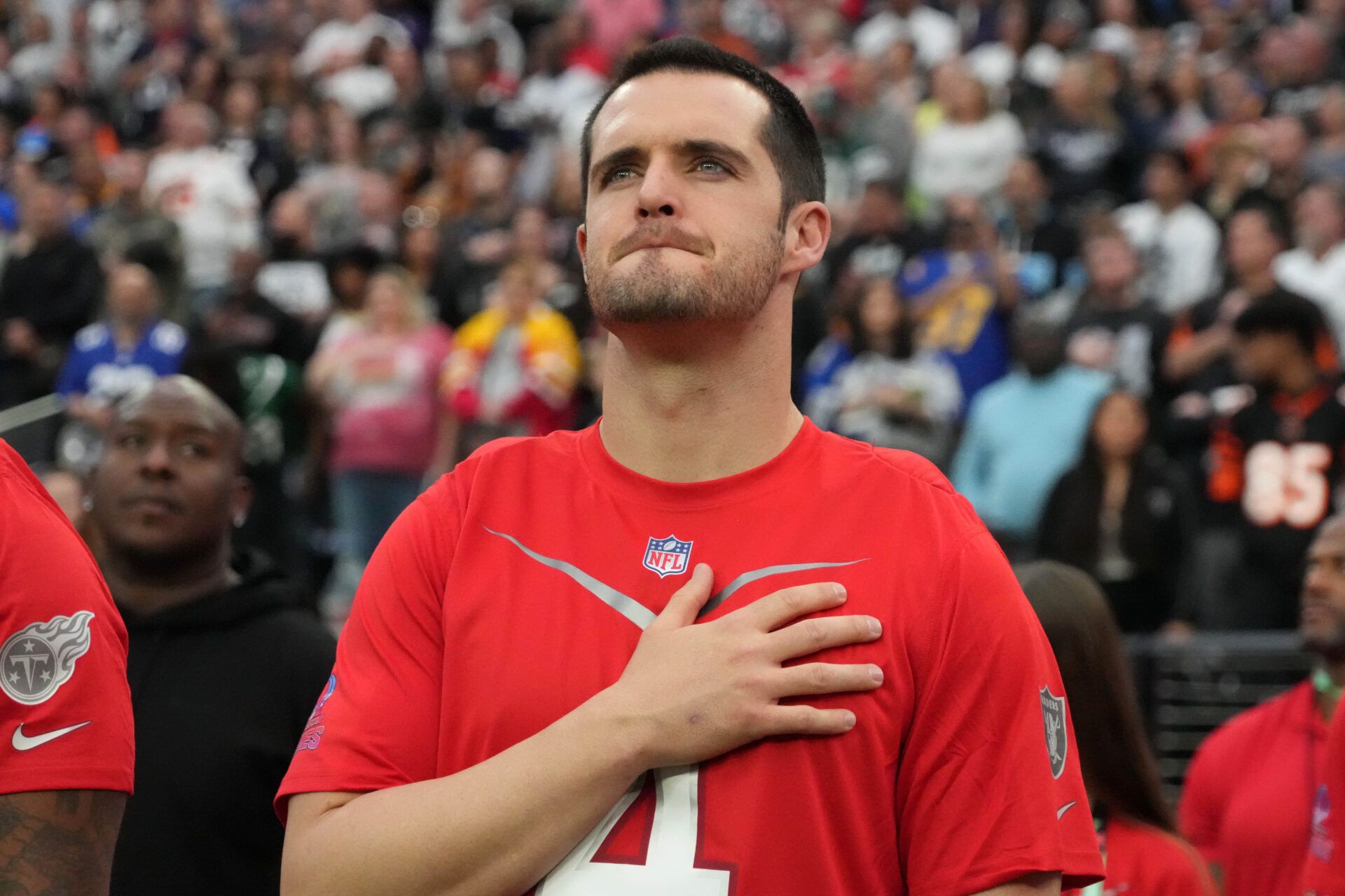 AFC quarterback Derek Carr of the Las Vegas Raiders (4) observes the playing of the national anthem during the Pro Bowl Games at Allegiant Stadium.