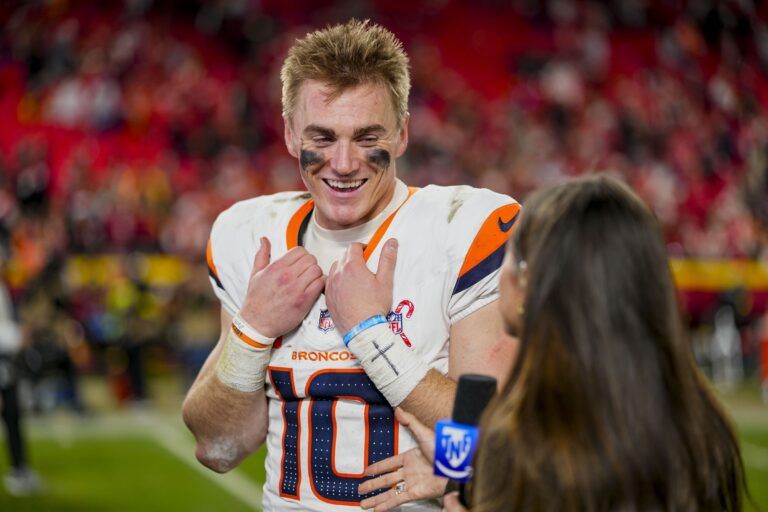 Denver Broncos quarterback Bo Nix (10) gives an interview after the game at GEHA Field at Arrowhead Stadium.
