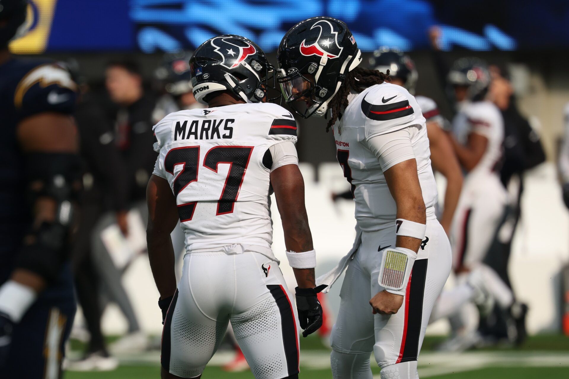 Houston Texans quarterback C.J. Stroud (7) celebrates with running back Woody Marks (27) after throwing a touchdown pass against the Los Angeles Chargers] during the first half at SoFi Stadium.