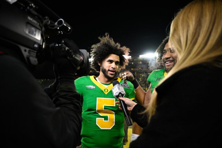 Oregon Ducks quarterback Dante Moore (5) is interviewed after the game against the James Madison Dukes at Autzen Stadium.