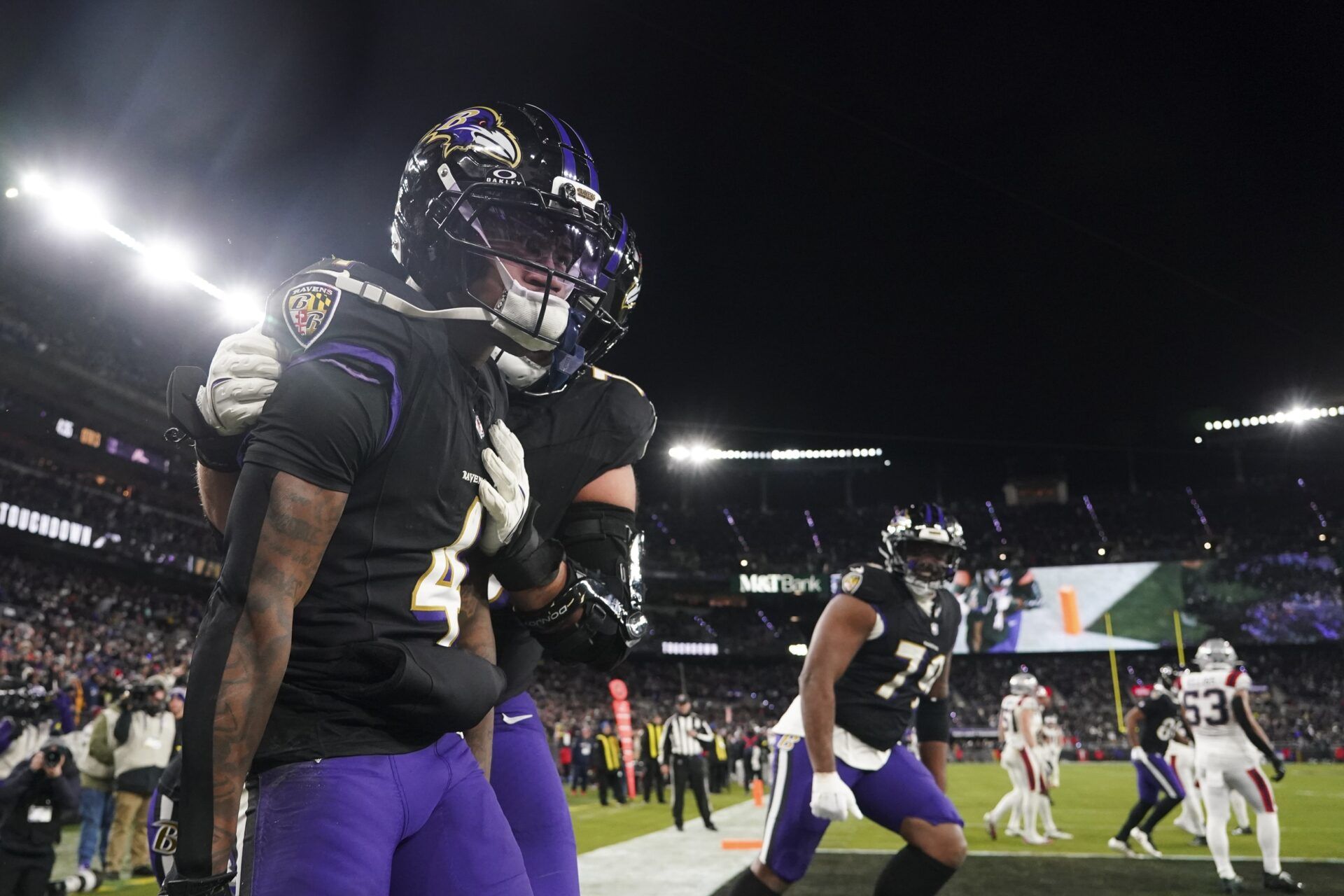 Baltimore Ravens wide receiver Zay Flowers (4) celebrates his touchdown against the New England Patriots with teammates during the second half of the game at M&T Bank Stadium.