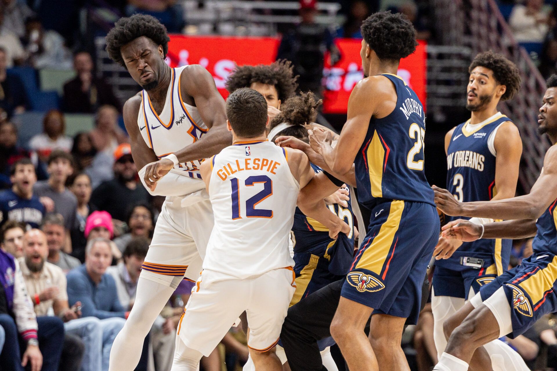 New Orleans Pelicans guard Jose Alvarado (15) gets into a scrum with Phoenix Suns center Mark Williams (15) over a play during the second half at Smoothie King Center.
