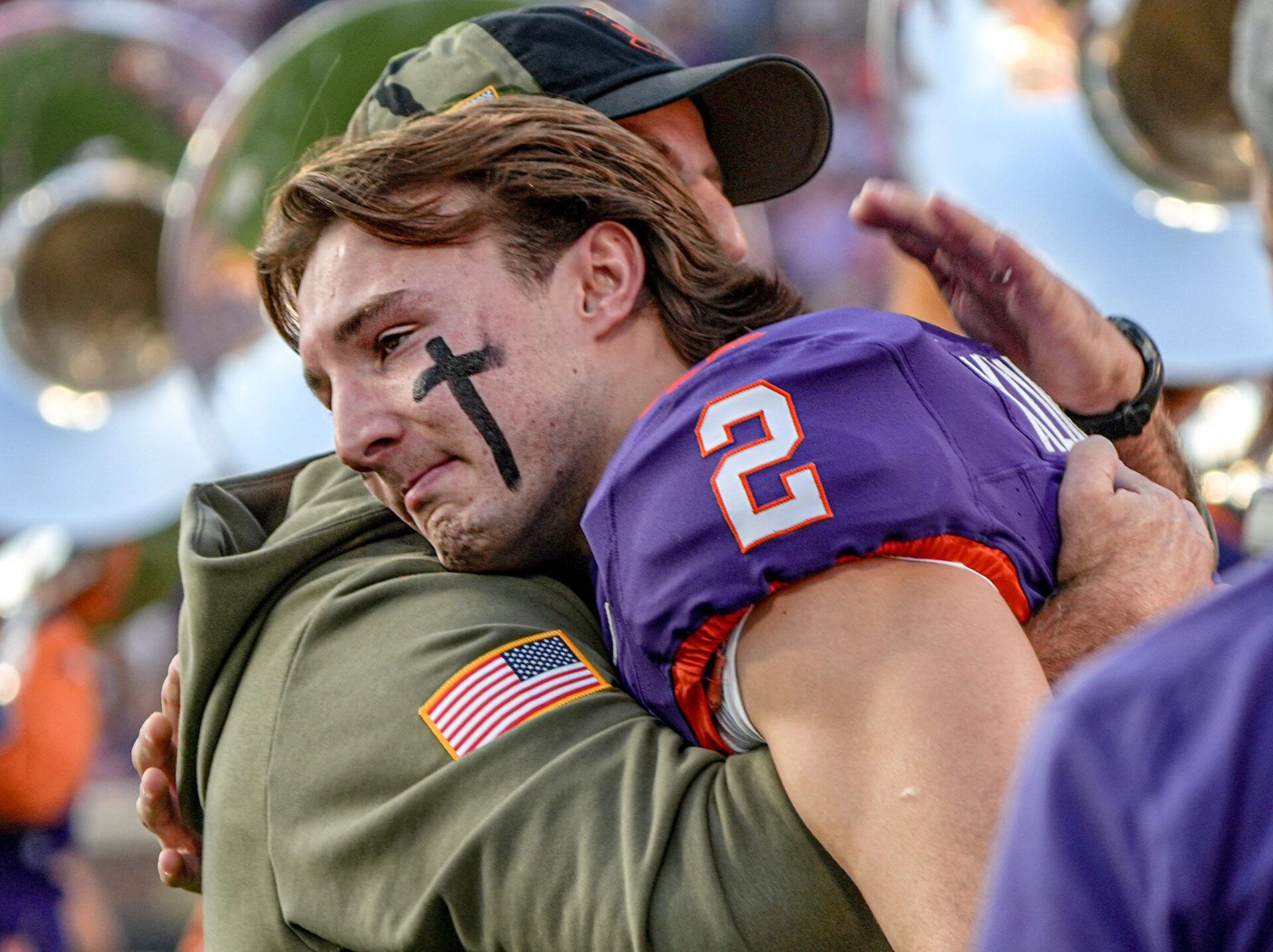 Clemson head coach Dabo Swinney hugs senior quarterback Cade Klubnik (2) before kickoff with Furman University at Memorial Stadium in Clemson, SC, Saturday, November 22, 2025.