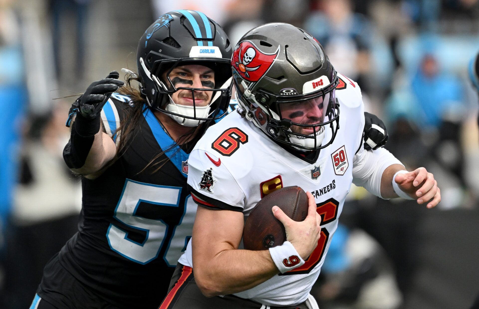 Carolina Panthers linebacker Christian Rozeboom (56) sacks Tampa Bay Buccaneers quarterback Baker Mayfield (6) during the first half at Bank of America Stadium.