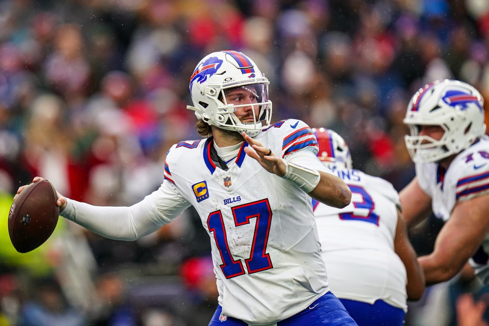 Buffalo Bills quarterback Josh Allen (17) passes the ball against the New England Patriots in the second half at Gillette Stadium.