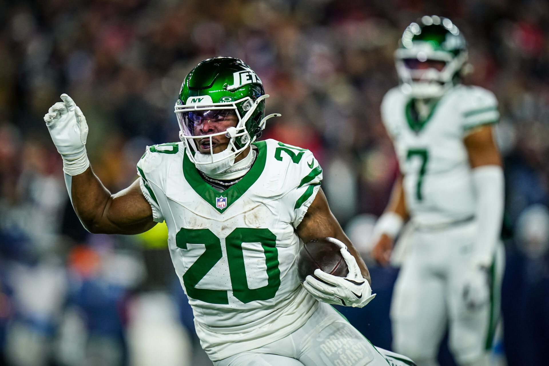 New York Jets running back Breece Hall (20) runs the ball against the New England Patriots in the third quarter at Gillette Stadium.