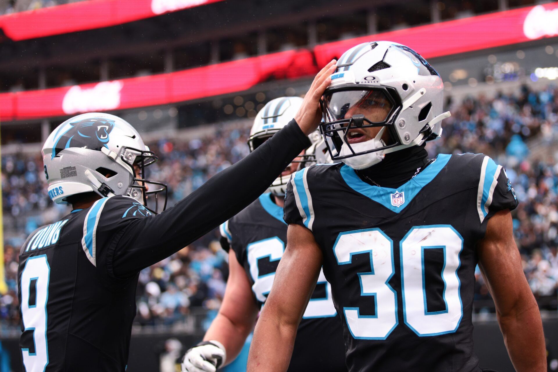 Carolina Panthers running back Chuba Hubbard (30) celebrates after scoring a touchdown during the first quarter against the Los Angeles Rams at Bank of America Stadium.