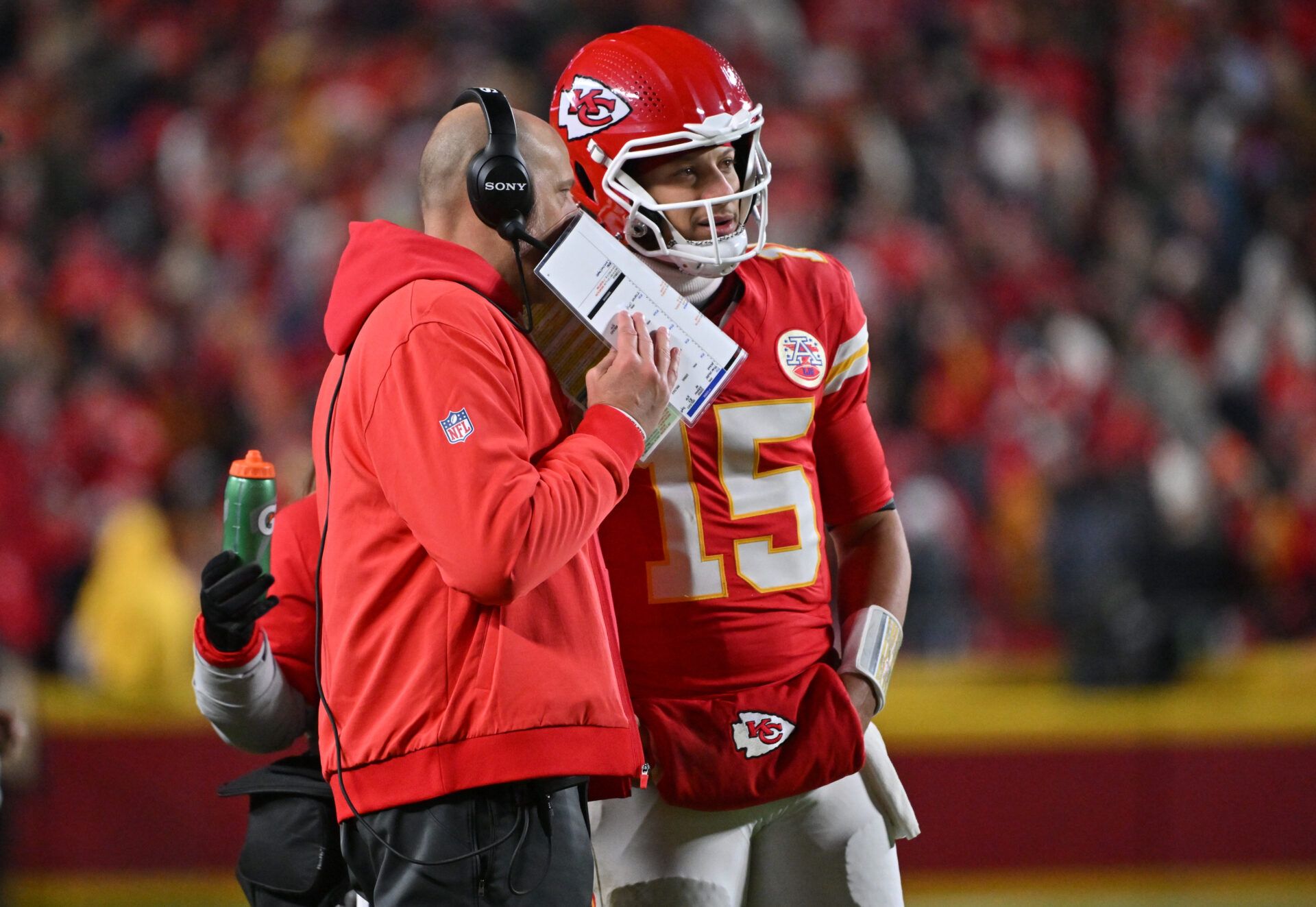 Kansas City Chiefs quarterback Patrick Mahomes (15) talks to Kansas City Chiefs offensive coordinator Matt Nagy during the second quarter against the Houston Texans at GEHA Field at Arrowhead Stadium.