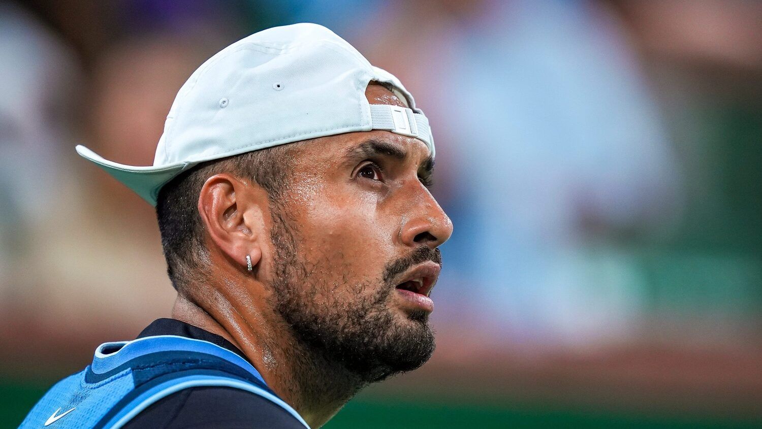 Nick Kyrgios looks up at the video boards before a point against Botic van de Zandschulp in the first set of their first-round match at the BNP Paribas Open in Indian Wells, Calif., Thursday, March 6, 2025.