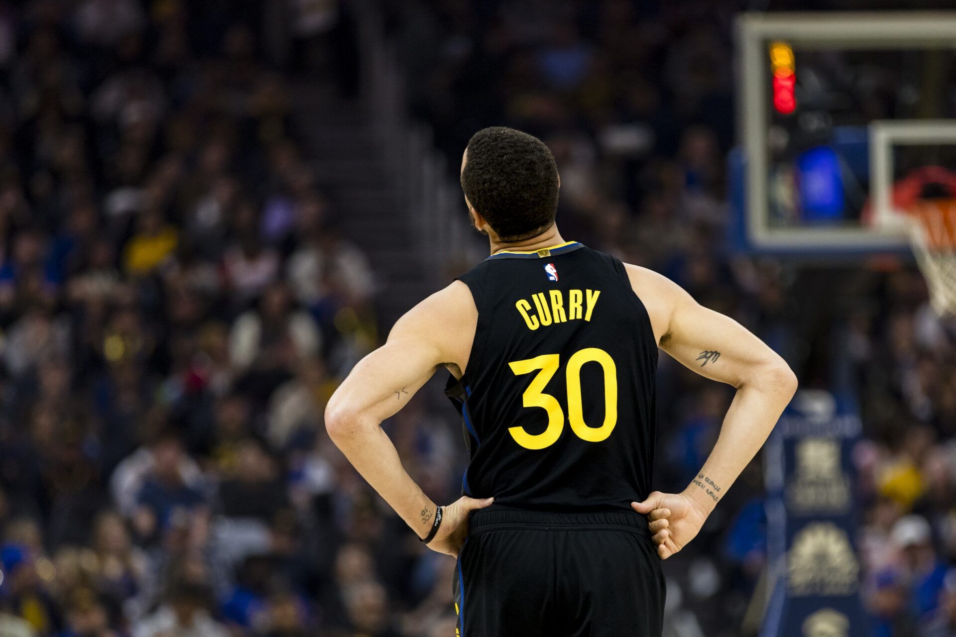 Golden State Warriors guard Stephen Curry (30) walks down the court during a break in the second quarter against the Toronto Raptors at Chase Center.