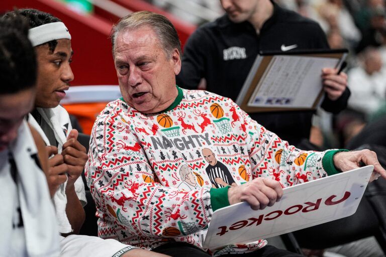 Michigan State head coach Tom Izzo talks to guard Jeremy Fears Jr. (1) at the bench during the first half against Oakland at Little Caesars Arena in Detroit on Saturday, Dec. 20, 2025.