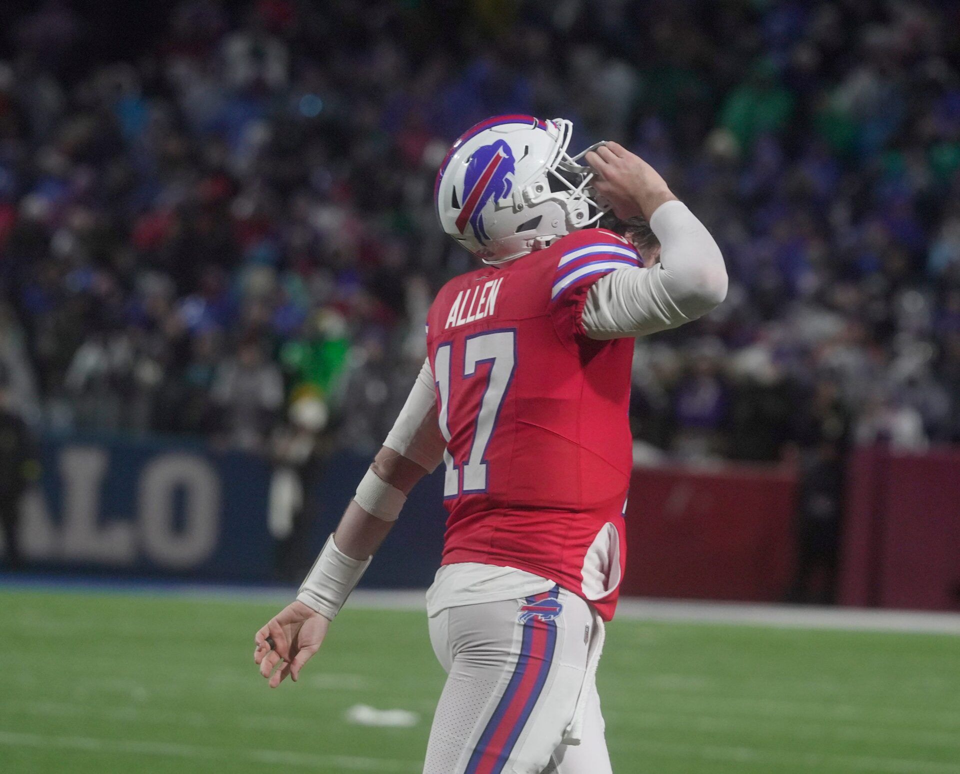 Buffalo Bills quarterback Josh Allen with helmet on his shoulder walks off the field after the failed two point conversion attempt during the fourth quarter against the Philadelphia Eagles at Highmark Stadium in Orchard Park on Dec. 28, 2025.