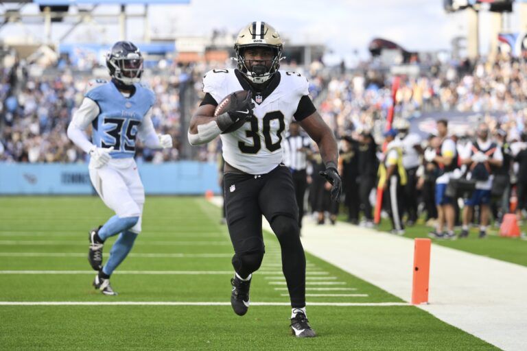 New Orleans Saints running back Audric Estime (30) runs for a touchdown against the Tennessee Titans during the second half of the game at Nissan Stadium.