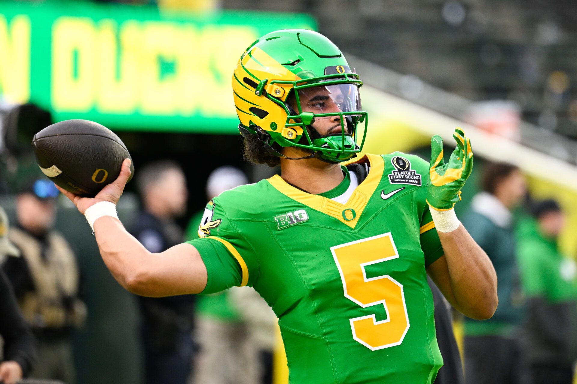 Oregon Ducks quarterback Dante Moore (5) warms up before the game against the James Madison Dukes at Autzen Stadium.
