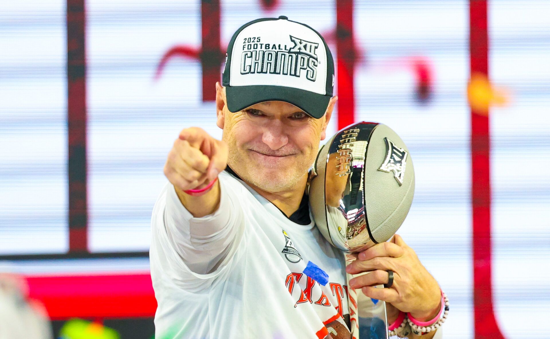Texas Tech Red Raiders head coach Joey McGuire celebrates with the Big 12 Championship trophy after the game against the BYU Cougars at AT&T Stadium.
