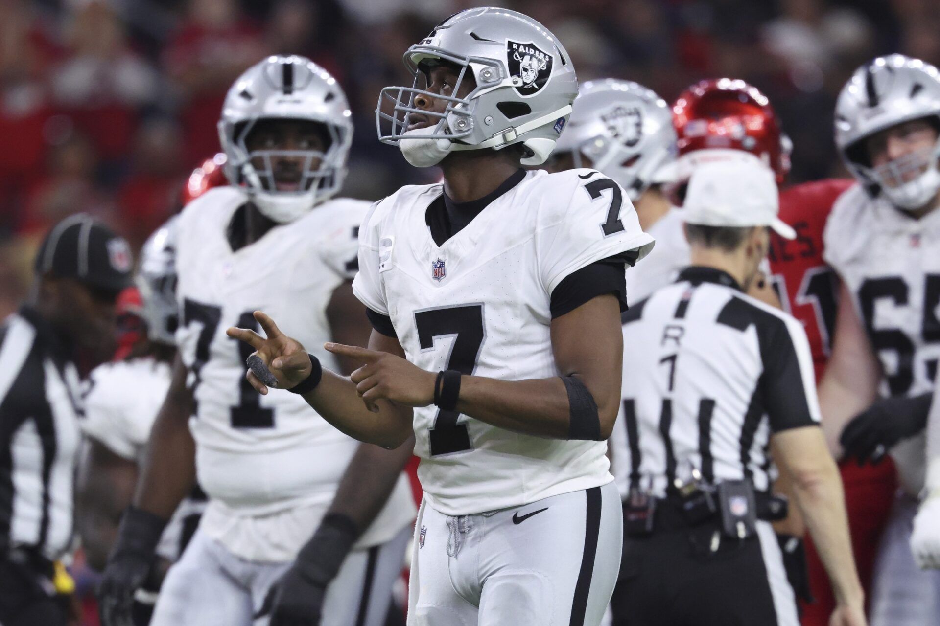 Las Vegas Raiders quarterback Geno Smith (7) reacts after a play during the second half against the Houston Texans at NRG Stadium.