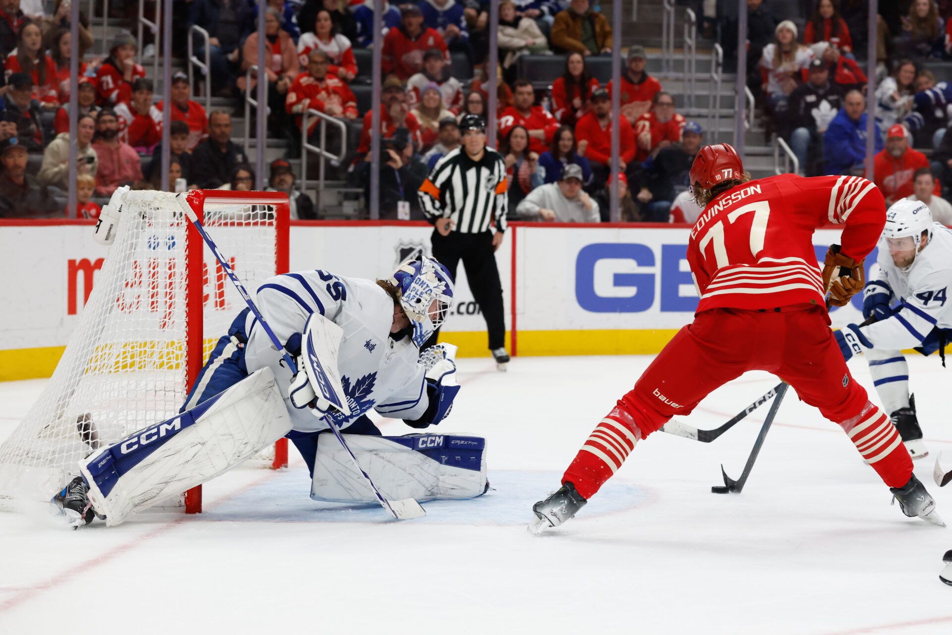 Detroit Red Wings defenseman Simon Edvinsson (77) scores on Toronto Maple Leafs goaltender Dennis Hildeby (35) in overtime at Little Caesars Arena.