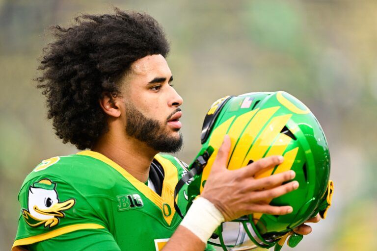 Oregon Ducks quarterback Dante Moore (5) looks on before the game against the James Madison Dukes at Autzen Stadium.