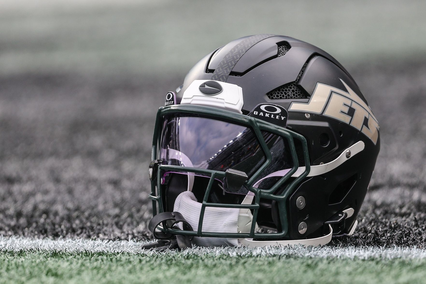 A general view of a Gotham City football rivalries helmet resting on the field before the game against the Miami Dolphins at MetLife Stadium.