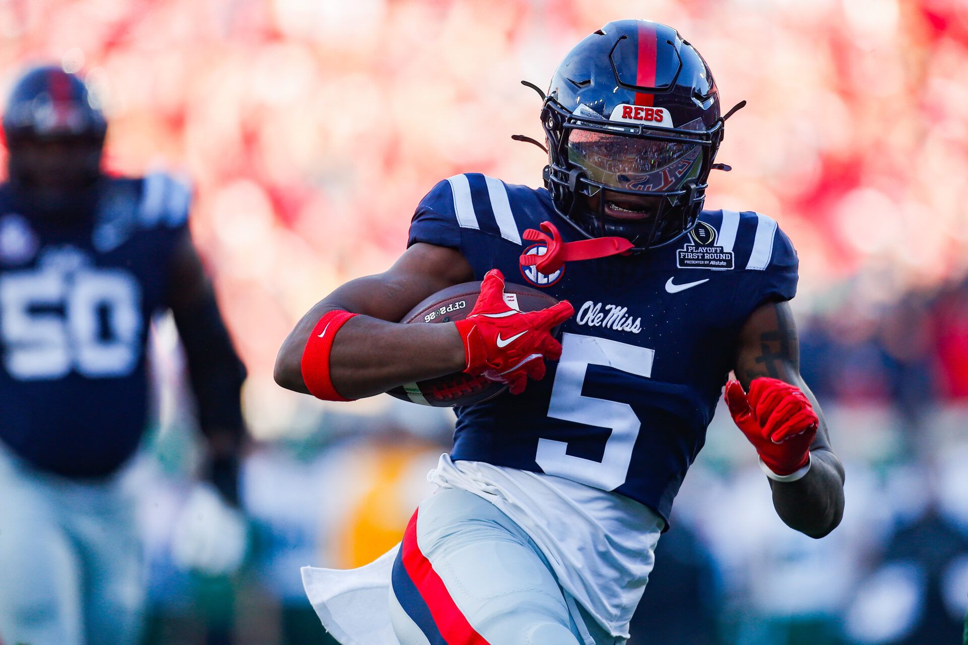 Mississippi Rebels running back Kewan Lacy (5) carries the ball for a touchdown against the Tulane Green Wave during the first half of a game at Vaught-Hemingway Stadium.