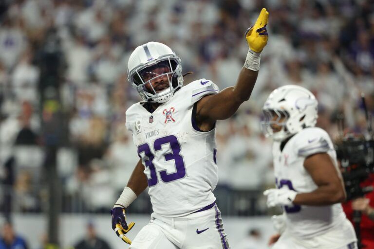Minnesota Vikings running back Aaron Jones Sr. (33) celebrates after scoring a touchdown against the Detroit Lions in the first quarter at U.S. Bank Stadium.