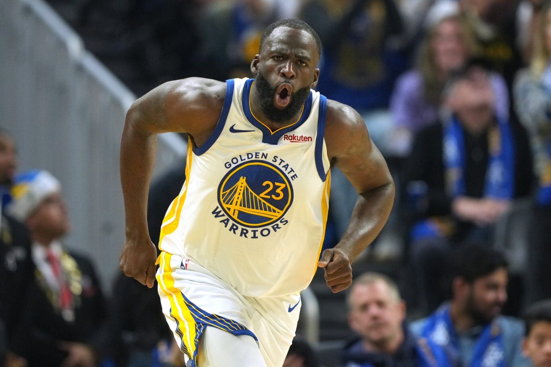 Golden State Warriors forward Draymond Green (23) reacts after making a three point basket against the Dallas Mavericks during the second quarter at Chase Center.