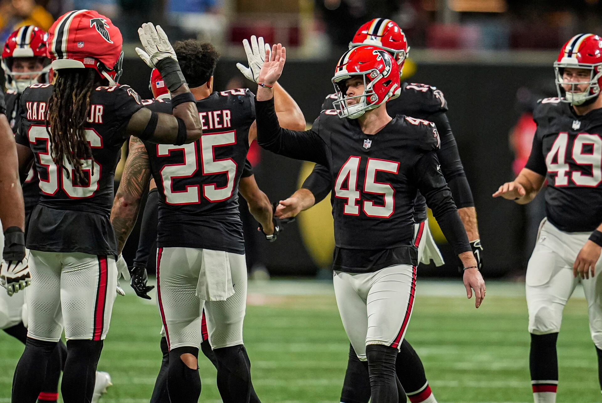 Atlanta Falcons place kicker Zane Gonzalez (45) reacts after kicking the go ahead field goal against the Los Angeles Rams during the second half at Mercedes-Benz Stadium.