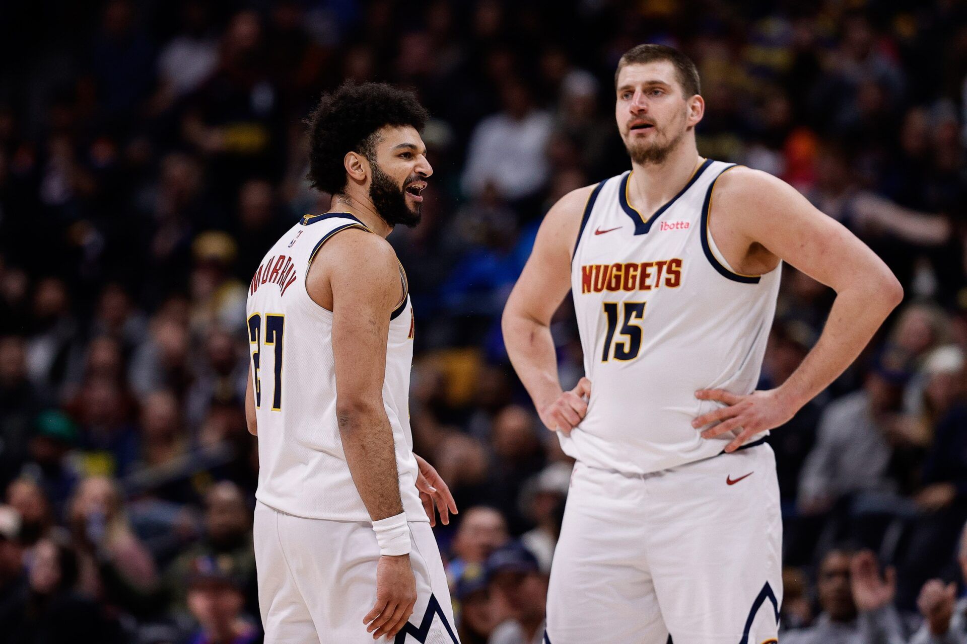 Denver Nuggets guard Jamal Murray (27) reacts after a call as center Nikola Jokic (15) looks on in the third quarter against the Portland Trail Blazers at Ball Arena.
