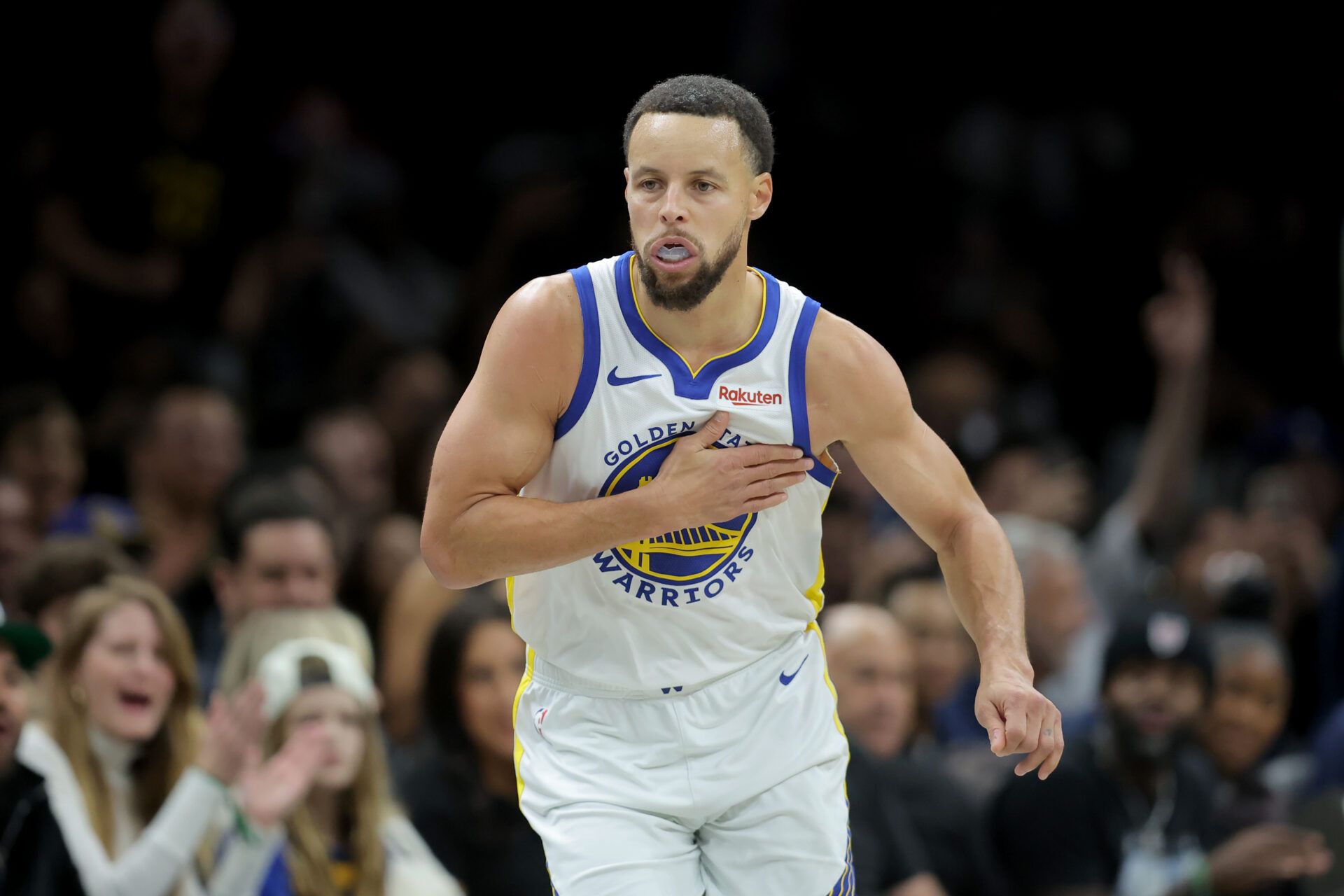 Golden State Warriors guard Stephen Curry (30) reacts after making a three point shot against the Brooklyn Nets during the third quarter at Barclays Center.