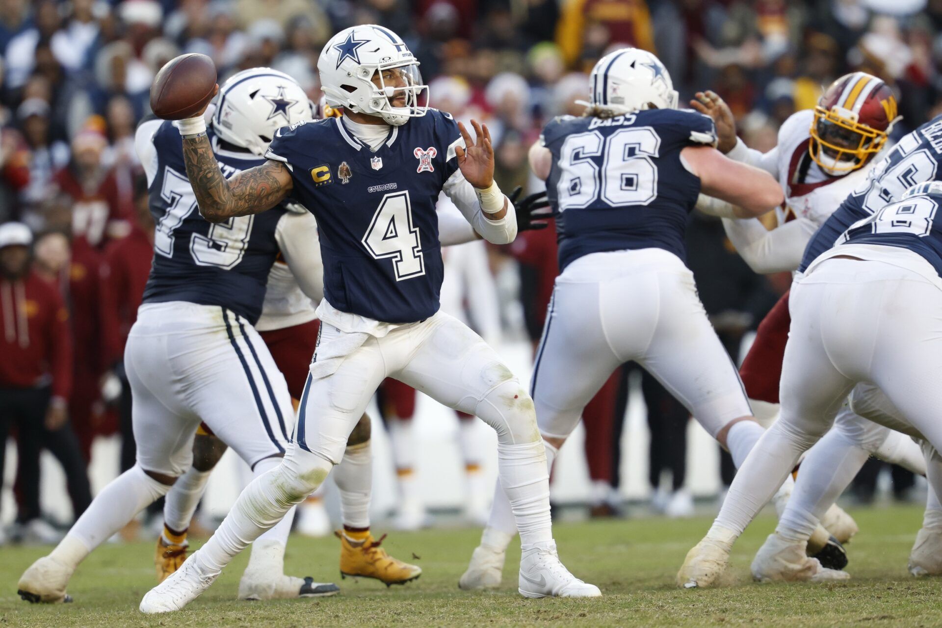 Dallas Cowboys quarterback Dak Prescott (4) passes the ball against the Washington Commanders during the second half at Northwest Stadium.