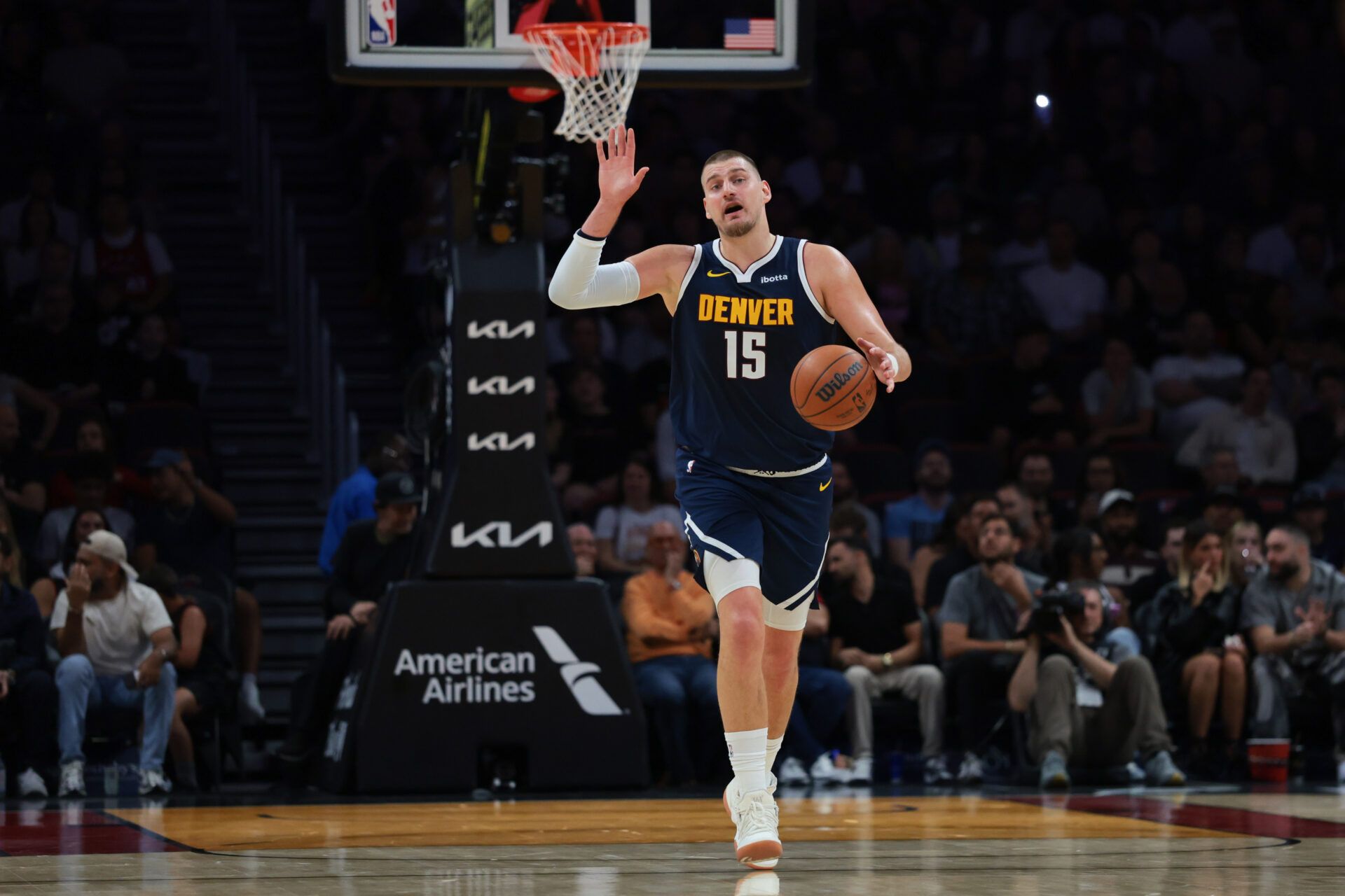 Denver Nuggets center Nikola Jokic (15) dribbles the basketball against the Miami Heat during the first quarter at Kaseya Center.