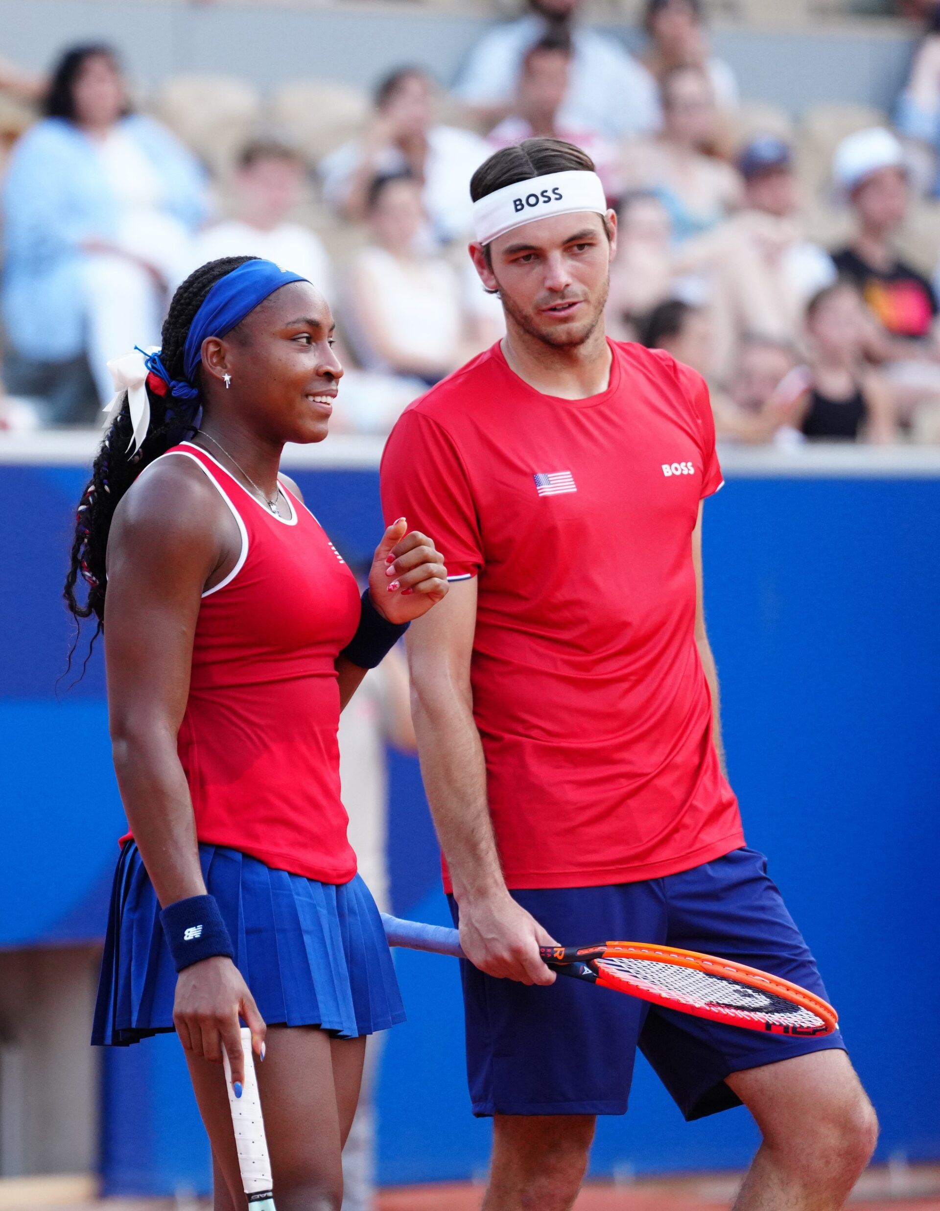 Taylor Fritz and Coco Gauff (USA) during their match against Nadia Podoroska and Maximo Gonzalez (ARG) in a mixed doubles tennis match during the Paris 2024 Olympic Summer Games at Stade Roland Garros.