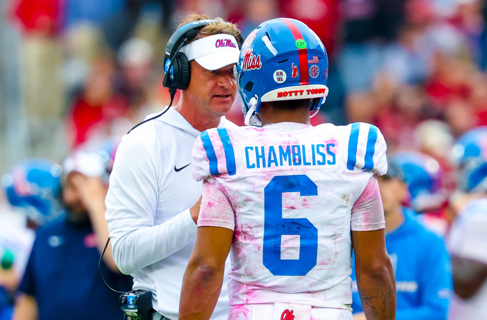 Ole Miss Rebels head coach Lane Kiffin speaks with Ole Miss Rebels quarterback Trinidad Chambliss (6) during the second half at Gaylord Family-Oklahoma Memorial Stadium.