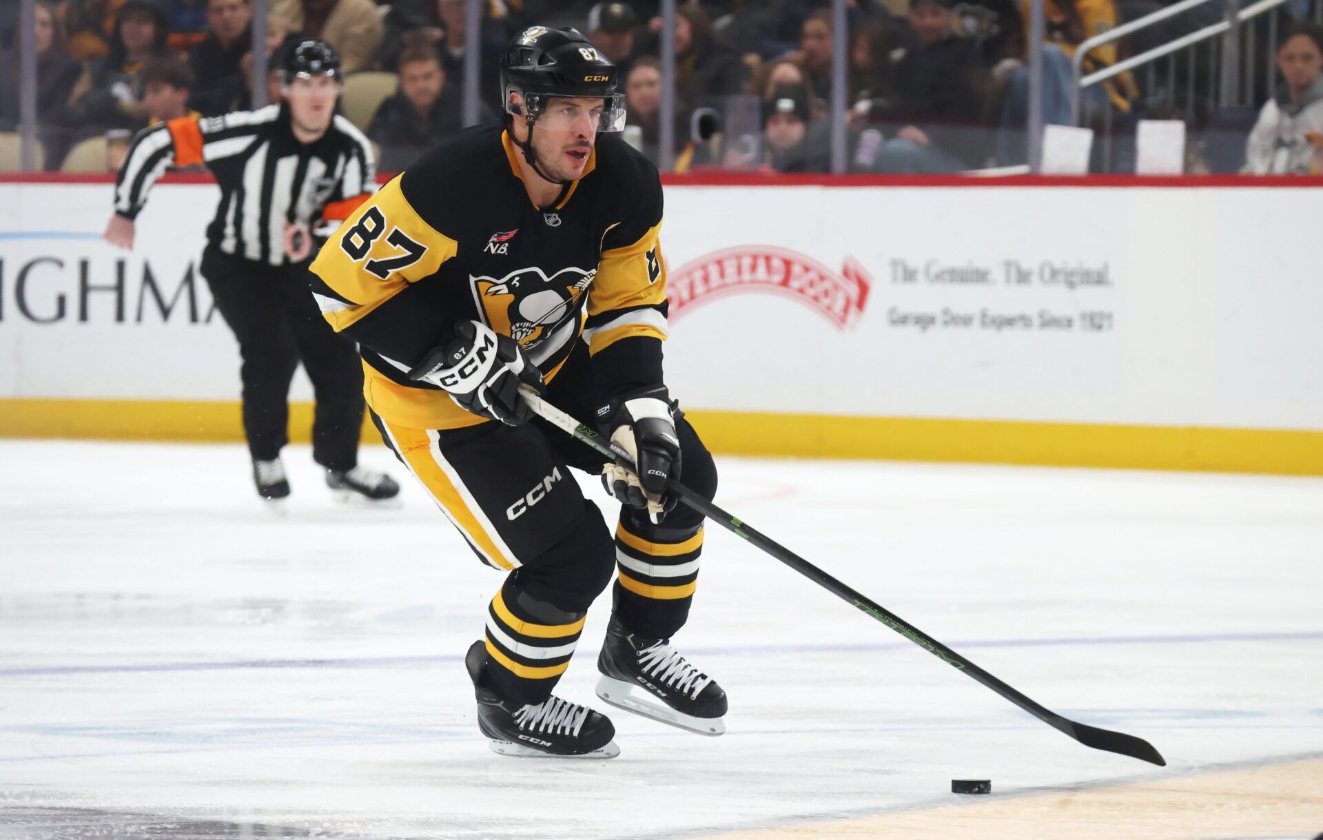 Pittsburgh Penguins center Sidney Crosby (87) skates up ice with the puck against the Carolina Hurricanes during the third period at PPG Paints Arena.