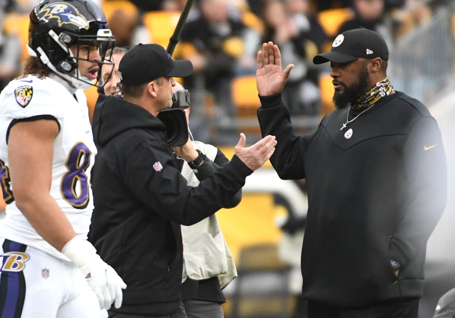 Baltimore Ravens head coach John Harbaugh (left) and Pittsburgh Steelers hjead coach Mike Tomlin shake hands before they play each other at Heinz Field.